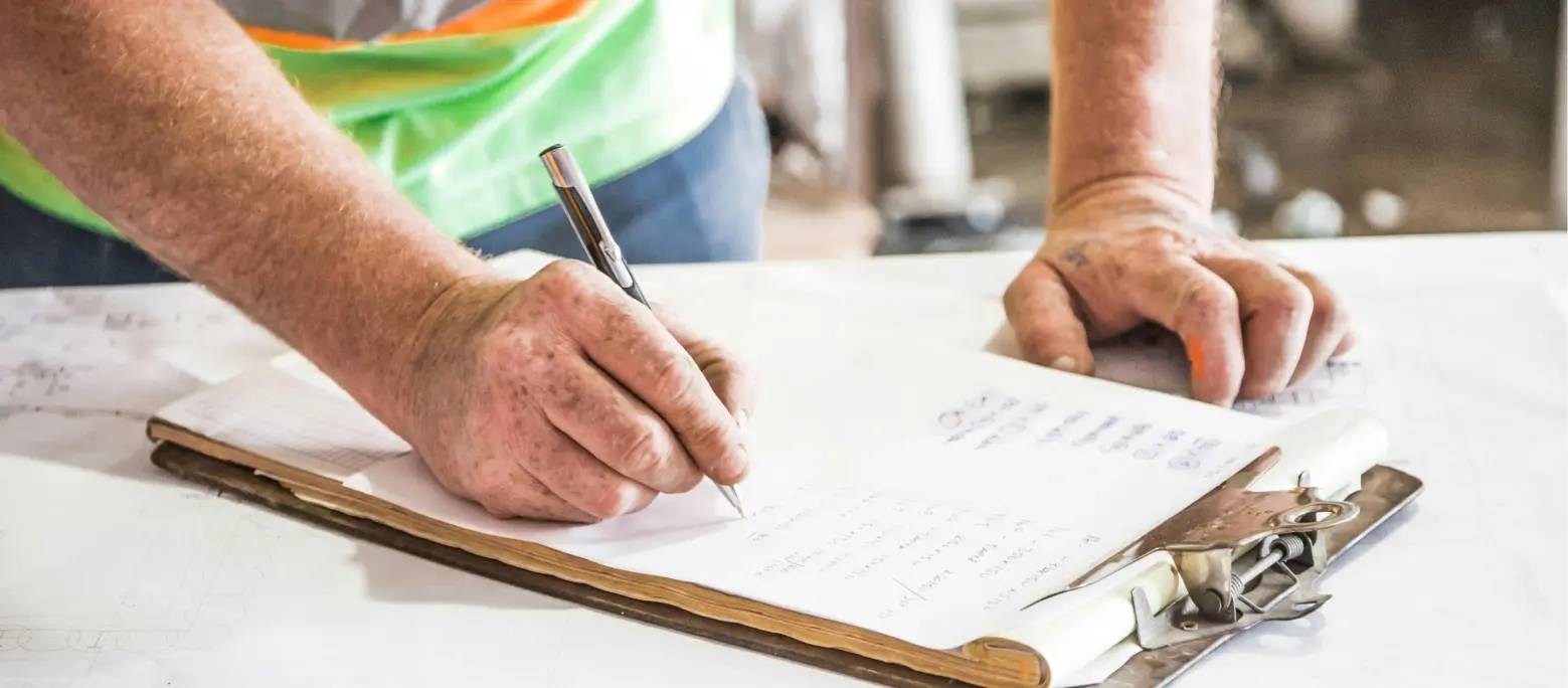 Person writing inspection reports